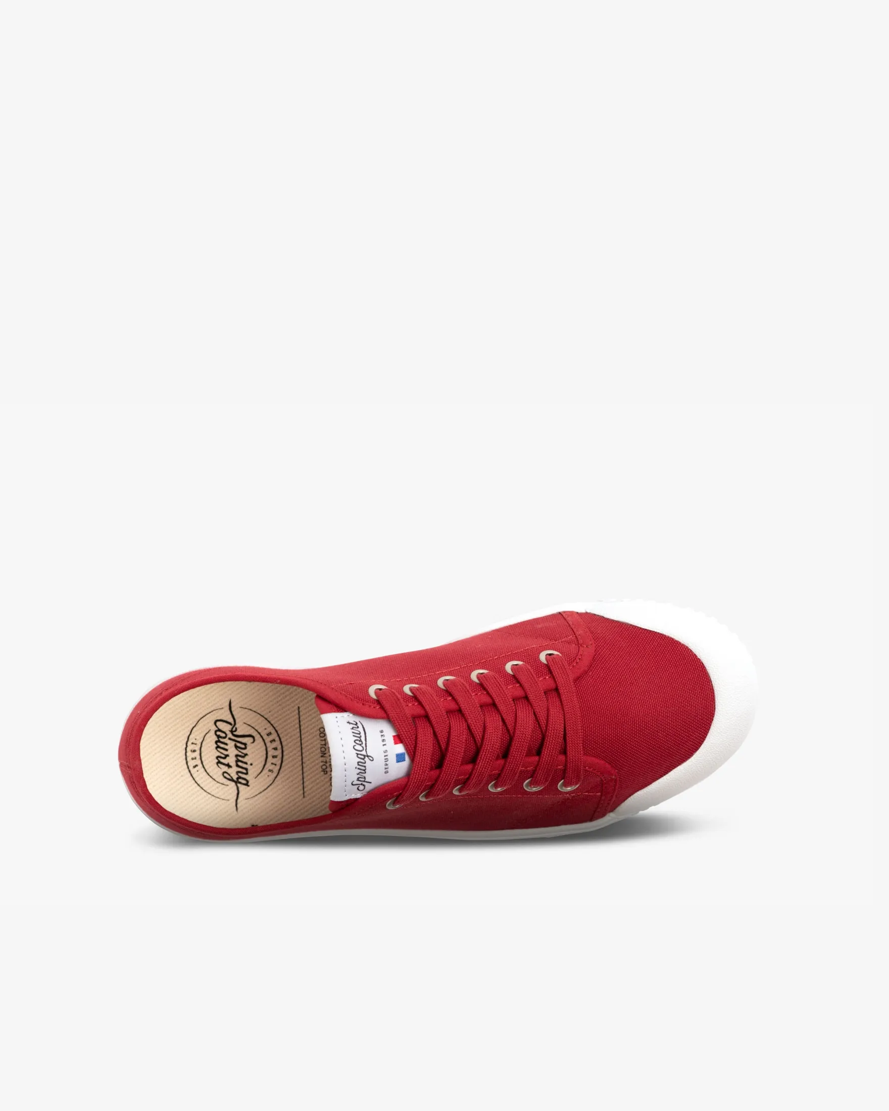 Red low top canvas trainer